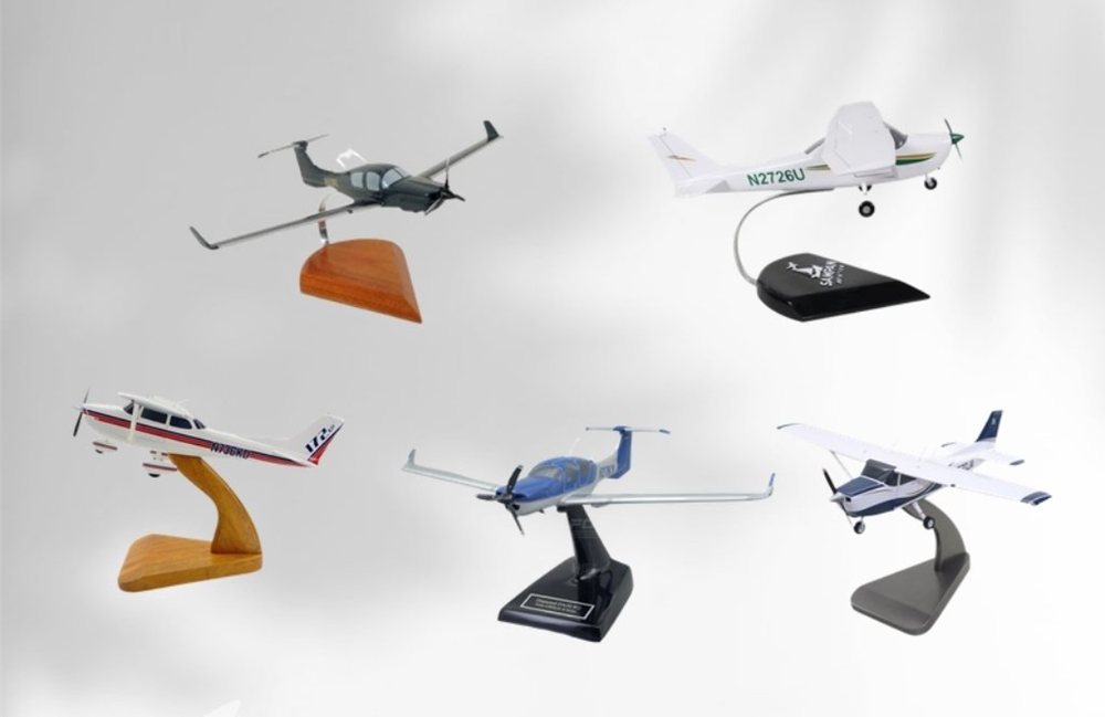 Scale aircraft models on stands, including custom models of customers' own aircraft, at the SAC Shop